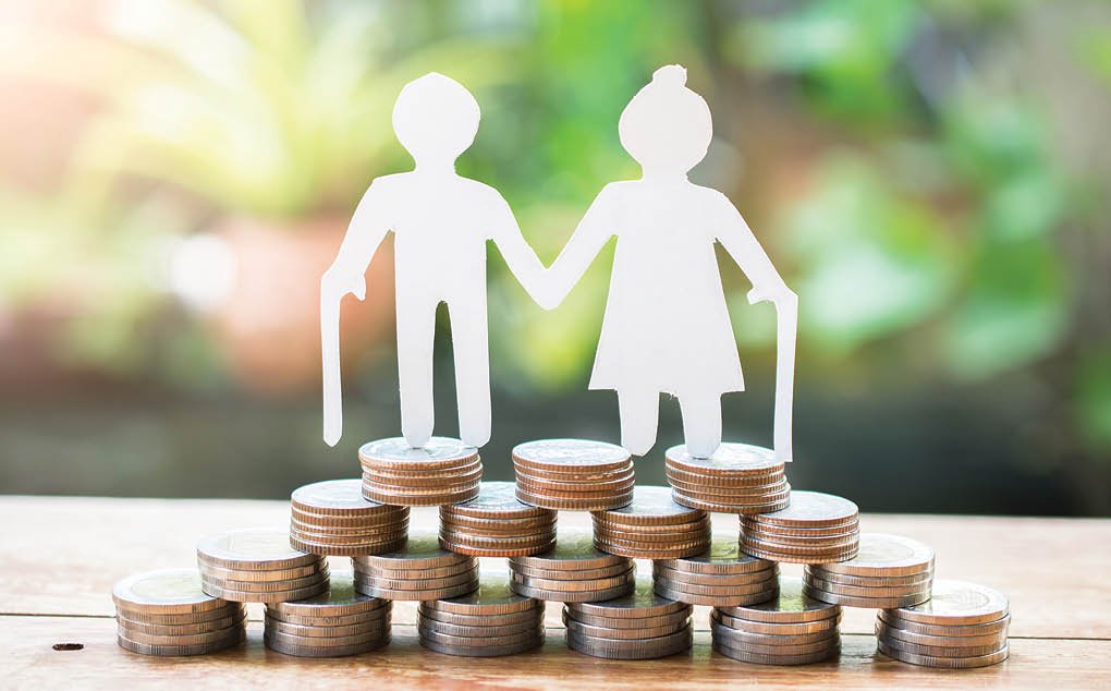 couple older model standing on money coins saving for concept investment mutual fund finance and pension retirement