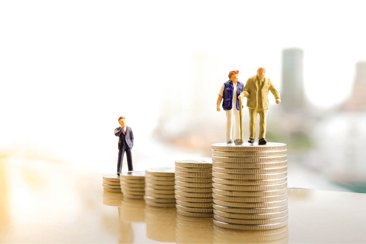 Concept of retirement planning  Miniature people: Old couple figure standing on top of coin stack 