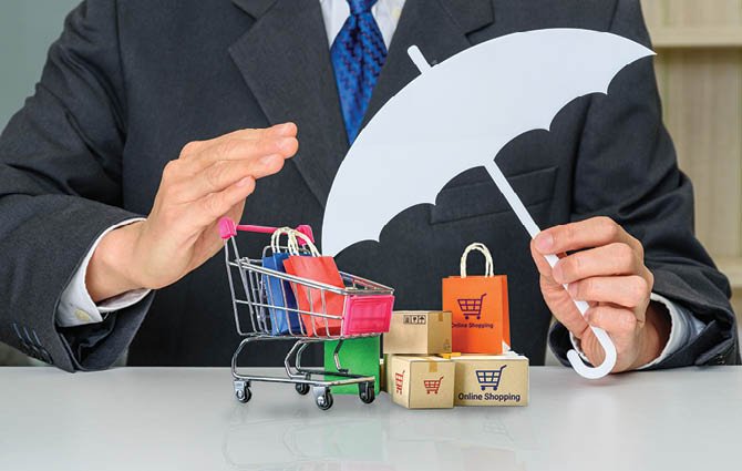 Consumer rights and consumer protection, business law concept : Buyer or purchaser protects bags and boxes of goods purchased online from internet retailer website, depicts caring on products bought