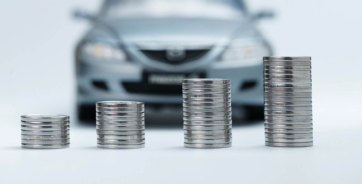 coin stacks in front of car