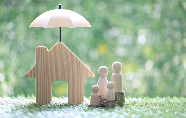 Protection,Model family on stack of coins money with model house under the umbrella on natural green background, Finance insurance and Safe investment concept
